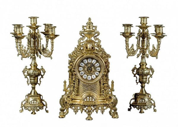 Clock set in antique look made of brass